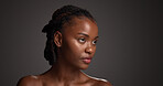 Black woman, beauty or thinking of skincare in studio, wellness shine or healthy glow for facial cosmetic. Self care, mockup space or person with dermatology, idea or flawless skin on gray background