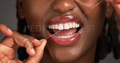 Buy stock photo Woman, teeth and hygiene with dental floss in studio for cleaning on a gray background. Closeup, female person or mouth of model with smile, wire or thread for tooth cavity, gum care or oral health