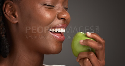 Buy stock photo Woman, laughing and healthy with apple, studio and snack with vitamin c, diet and nutrition benefits. Gray background, antioxidants and black person with fruit for wellness, eating and digestion