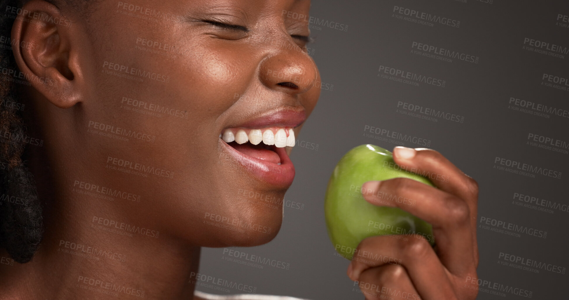 Buy stock photo Woman, laughing and healthy with apple, studio and snack with vitamin c, diet and nutrition benefits. Gray background, antioxidants and black person with fruit for wellness, eating and digestion