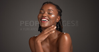 Buy stock photo Happy, face cream and black woman in studio for skincare, hydration and natural beauty on dark background. Mockup space, dermatology and person laugh with lotion, moisturizer and cosmetics for glow