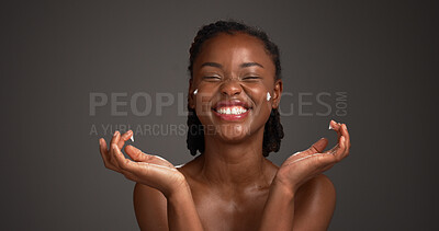 Buy stock photo Cream, happy and black woman in studio for skincare, cosmetics and collagen benefits on dark background. Space, dermatology and person with lotion for moisturizer, beauty products and hydration