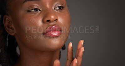 Buy stock photo Acne patch, beauty and lip gloss with black woman on studio space for cosmetics or dermatology. Inspection, skincare and treatment with African model isolated on gray background to remove pimple