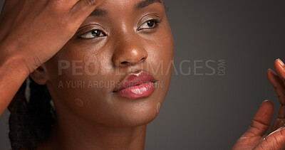 Buy stock photo Acne patch, lip gloss and skincare with black woman on studio space for cosmetics or dermatology. Beauty, inspection and treatment with African model isolated on gray background to remove pimple