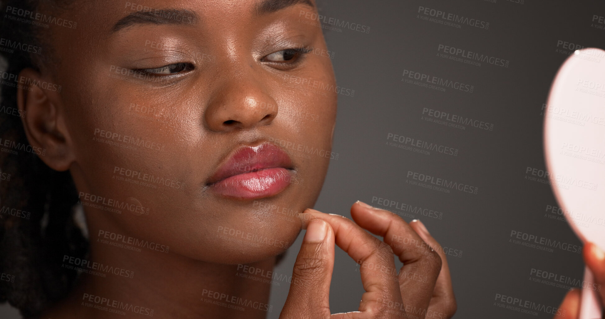 Buy stock photo Acne patch, beauty and mirror with black woman on studio space for cosmetics or dermatology. Inspection, routine and skincare with African model isolated on gray background to remove pimple or zit