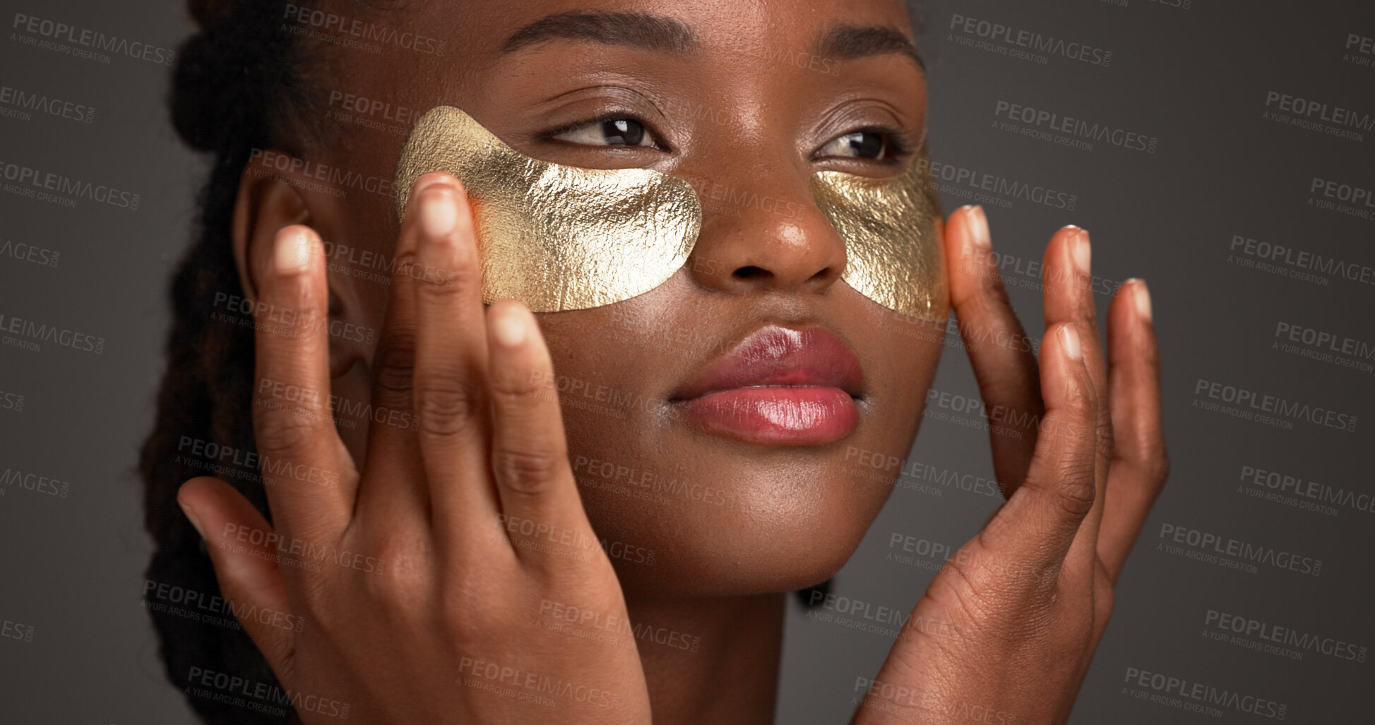 Buy stock photo Black woman, beauty and studio with eye patches for skincare or collagen on a gray background. Female person, gold or face mask with hyaluronic acid for anti aging treatment, vitamin C or hydration