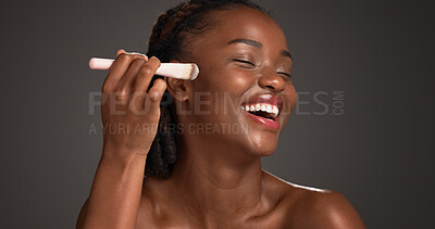 Buy stock photo Black woman, makeup brush and laugh with beauty in studio, space and foundation on dark background. African girl, happy and cosmetic tools for powder, concealer and excited with product for skin