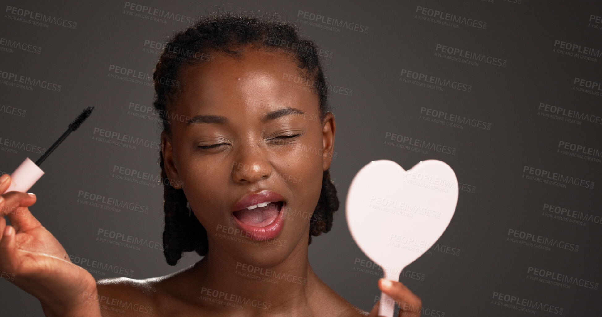 Buy stock photo Studio, mirror and woman with mascara, makeup and cosmetics application for eyelashes and self care. Gray background, makeover and black person with tools for beauty extension, glow or transformation