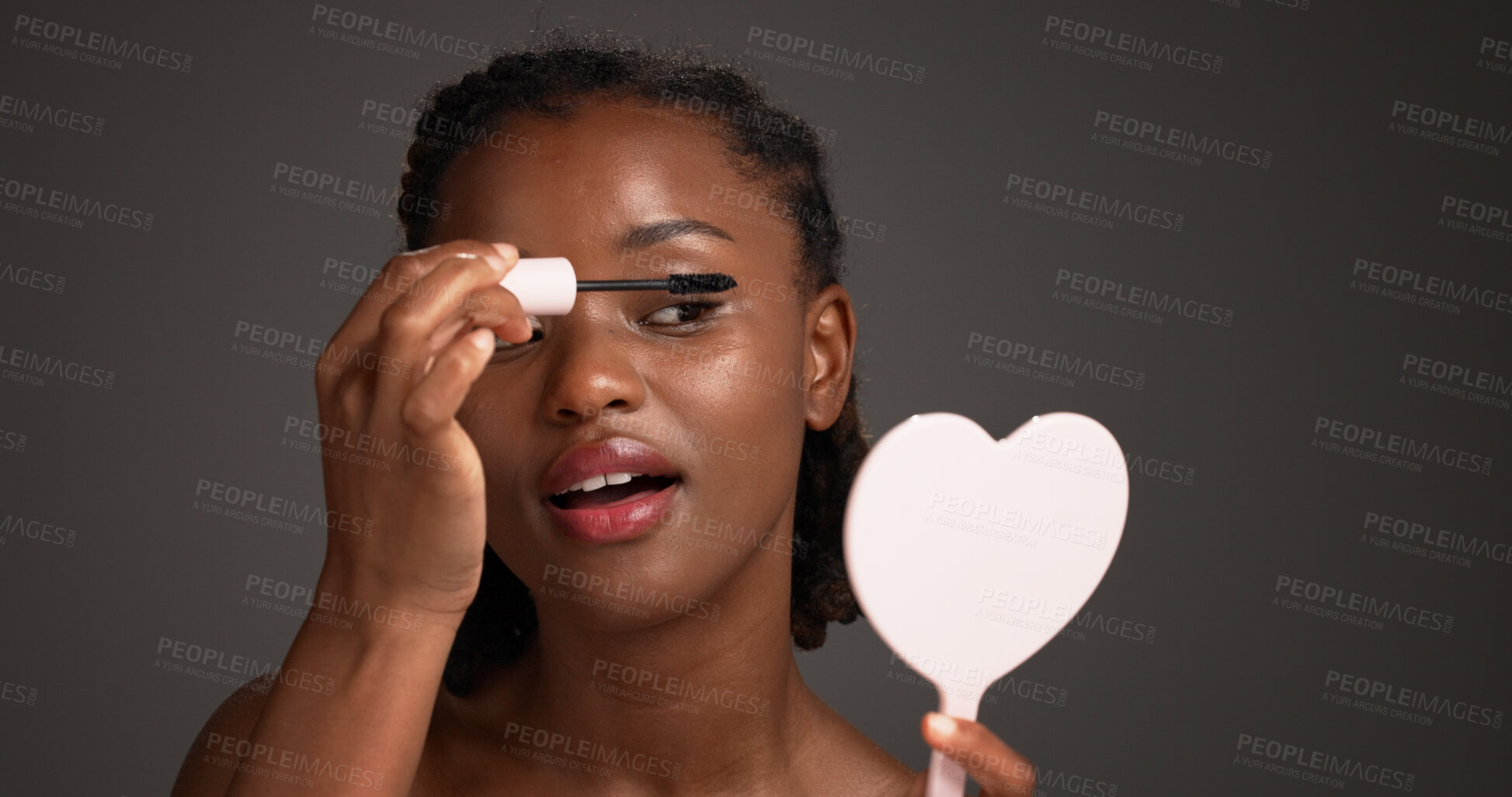 Buy stock photo Studio, mirror and woman with mascara, self care and cosmetics application for eyelashes and makeup. Gray background, makeover and black person with tools for beauty extension, glow or transformation