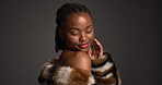 Luxury skincare, beauty and black woman in studio with glow, self care and glamour. Makeup, cosmetics and happy model with fur coat for aesthetic, healthy skin or dermatology on dark background space