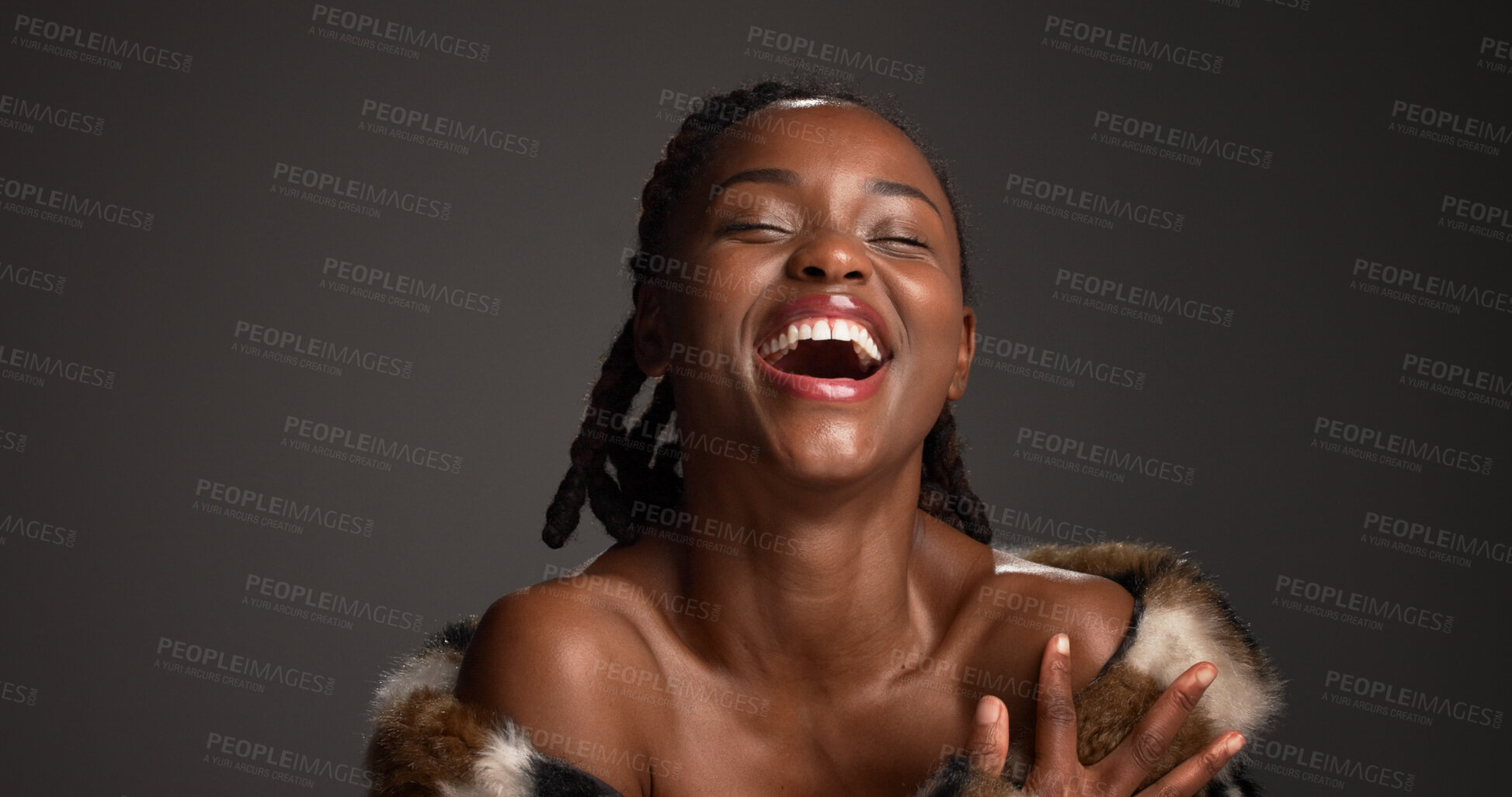 Buy stock photo Happy, black woman and laughing for beauty in studio with cosmetics, facial glow and aesthetic. Space, female person and makeup for luxury shine, fur coat and glamour for makeover on gray background