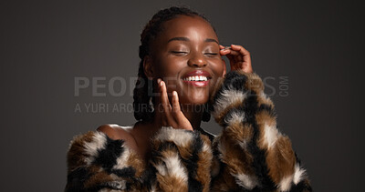 Buy stock photo Skincare, dermatology and happy black woman with beauty, self care and glamour in studio. Makeup, fur coat and model with cosmetics for luxury aesthetic, healthy skin or touch face on dark background