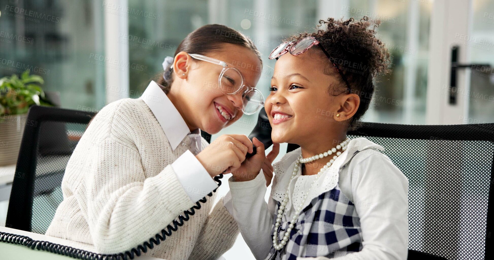 Buy stock photo Laugh, phone call and children in office for business, deal or negotiation with communication. Happy, landline and girl kids on mobile discussion for cosplay with corporate career in workplace.