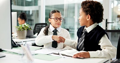 Buy stock photo Children, business and playing with handshake in office for junior partnership, cosplay or deal. Girl, boy or kids shaking hands with documents for career day, teamwork or pretending in workplace