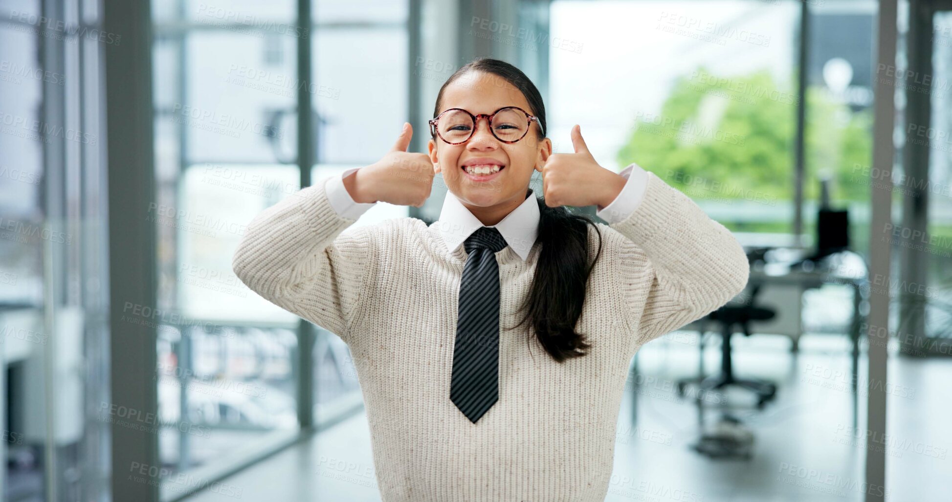 Buy stock photo Happy girl, portrait and playing business with thumbs up in office for junior internship or cosplay. Person, child or kid with smile, like emoji or yes sign for career day or pretending in workplace