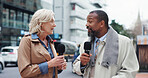 Talking, microphone and reporters with interview in city, breaking news or story. Mature people, journalist or interviewer outdoor for live broadcast, announcement or information update on street