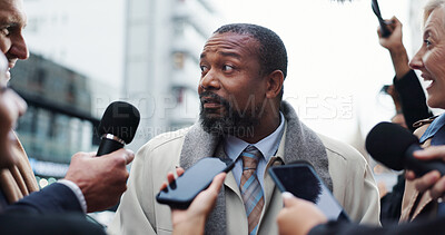 Buy stock photo Man, politician and talking to press, city and journalists with election questions and conversation. Outdoor, interview and government official with reporters for campaign update and people with mic