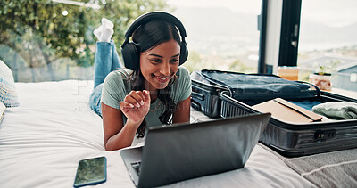 Buy stock photo Video call, laptop and luggage with woman in hotel for travel blog writer, streaming chat or network. Virtual contact, research or resort review with person and headphones in house rental for webinar