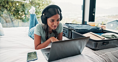 Buy stock photo Headphones, laptop and luggage with woman in hotel for travel blog writer, streaming service and freelancer. Music subscription, destination research and resort review with person in house rental