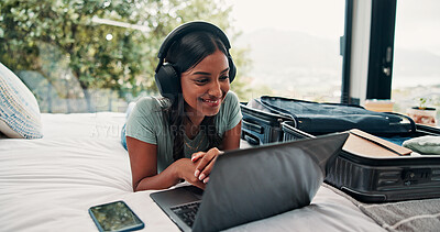 Buy stock photo Music, laptop and smile with woman in hotel for travel blog writer, streaming service and luggage. Radio subscription, trip research and resort review with person and headphones in house rental