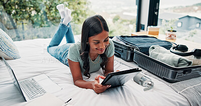 Buy stock photo Happy woman, travel and tablet with suitcase in bed for holiday, weekend or vacation in hotel. Female person, traveler or tourist with technology, luggage or laptop for online accommodation or app