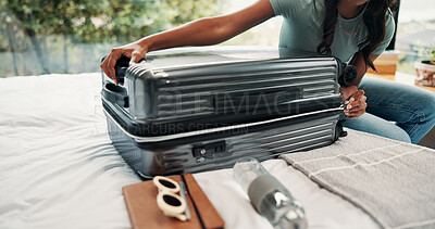 Buy stock photo Hands, packing and suitcase with person on bed in home for holiday, travel or vacation. Closing, getting ready and luggage with tourist or traveler in bedroom of apartment for trip preparation