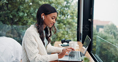 Buy stock photo Earphones, laptop and remote work with woman at window in home for online planning or research. Computer, typing and view with freelance employee at desk in apartment for small business startup