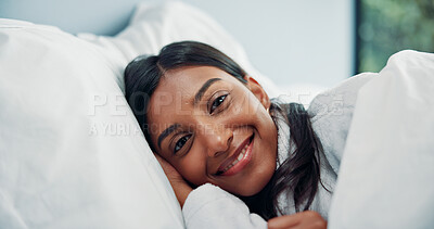 Buy stock photo Break, portrait and smile of woman in hotel bed for comfort, cozy or wellness on lazy weekend morning. Relax, travel and wake up with happy Indian person in bedroom  for accommodation or hospitality