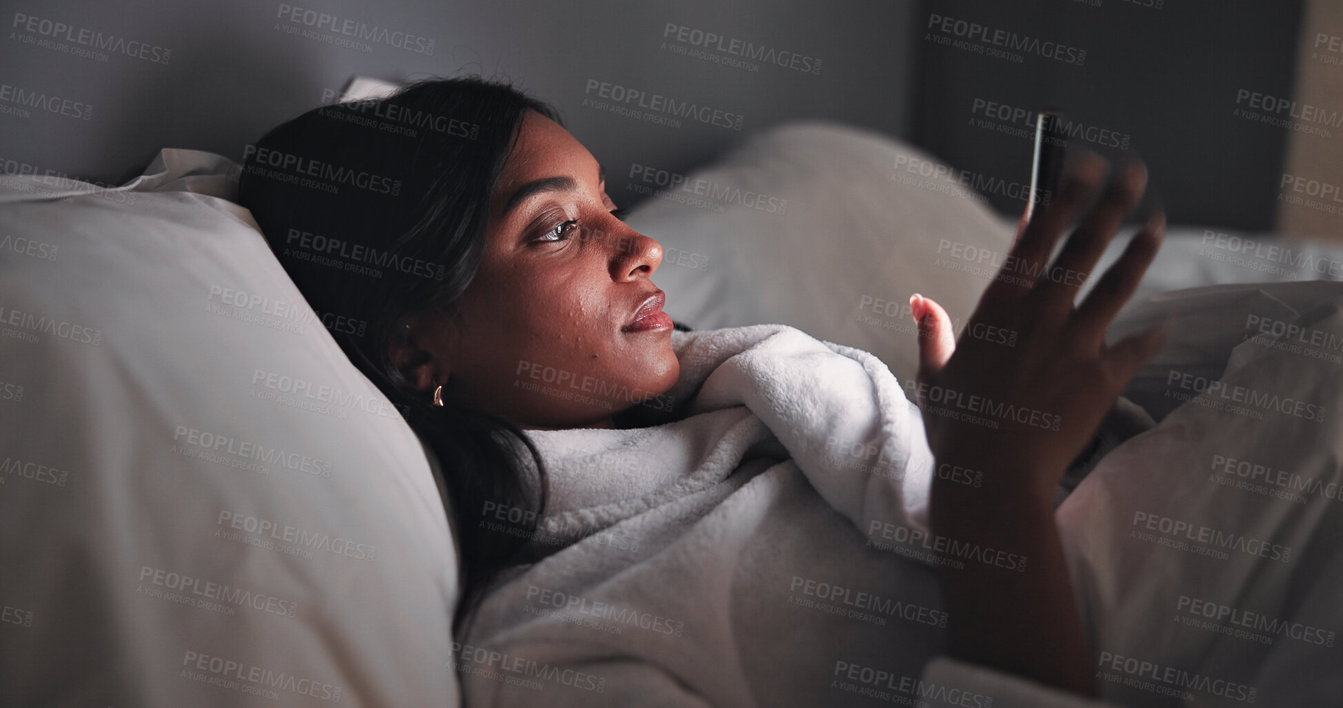 Buy stock photo Streaming, night or woman in bed with phone, online reading or video browse on social media. Relax, ebook and girl in house with tech, entertainment subscription or digital app scroll in late evening