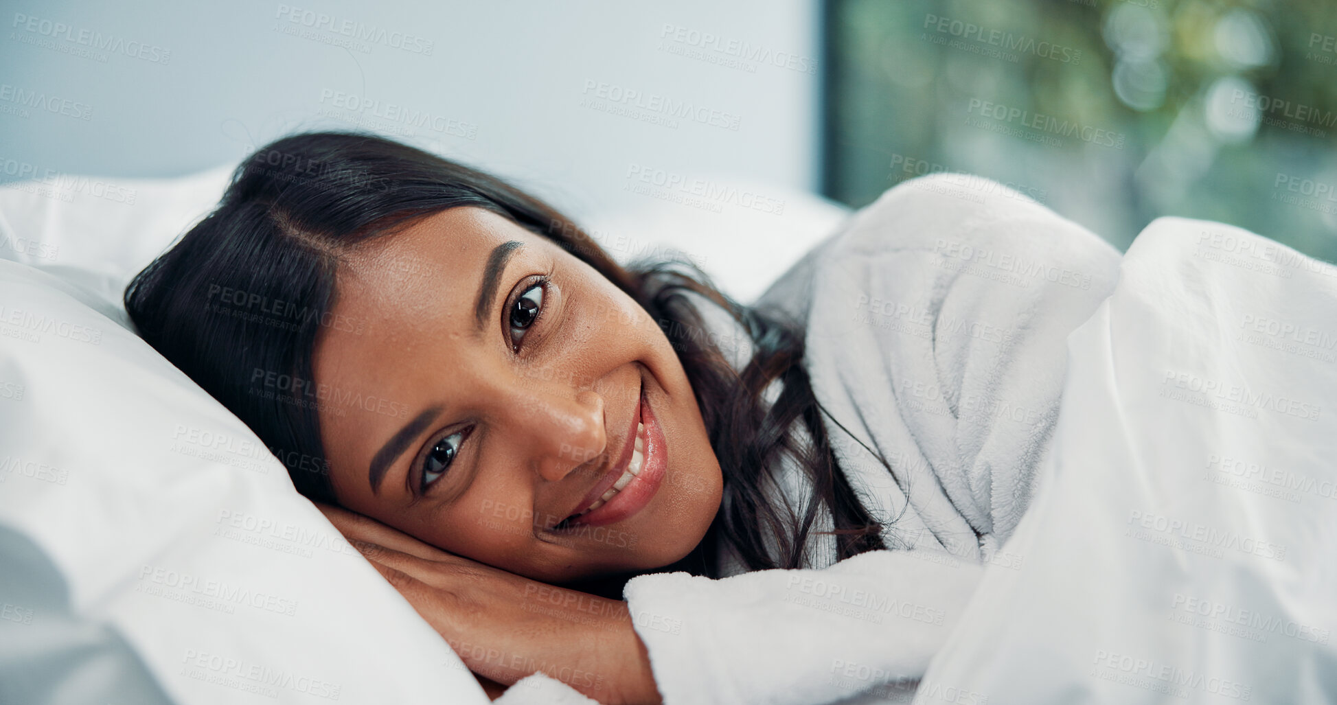 Buy stock photo Break, portrait and relax with woman in bed for comfort, cozy or wellness on lazy weekend morning. Awake, smile and travel with happy Indian person in hotel bedroom for accommodation or hospitality