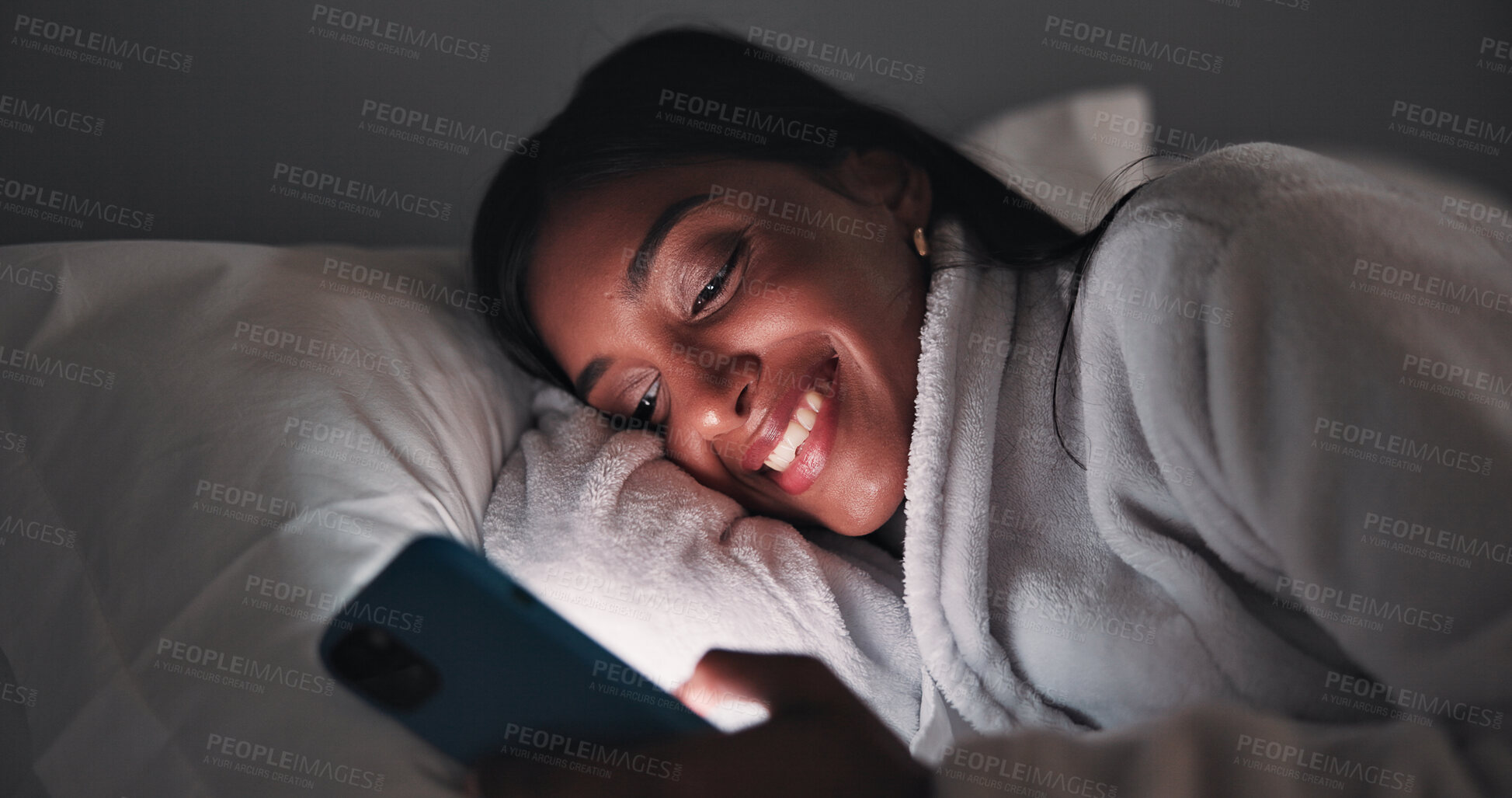 Buy stock photo Smile, night or woman in bed with phone, online reading or video browse on social media. Happy, dark and female person in house with tech, ebook subscription or digital app scroll in late evening.