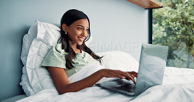 Buy stock photo Happy woman, typing and remote work in bed with laptop for journalism, news and story publication. Freelance writer, person or pajamas in home with computer for editing article, online blog and post.