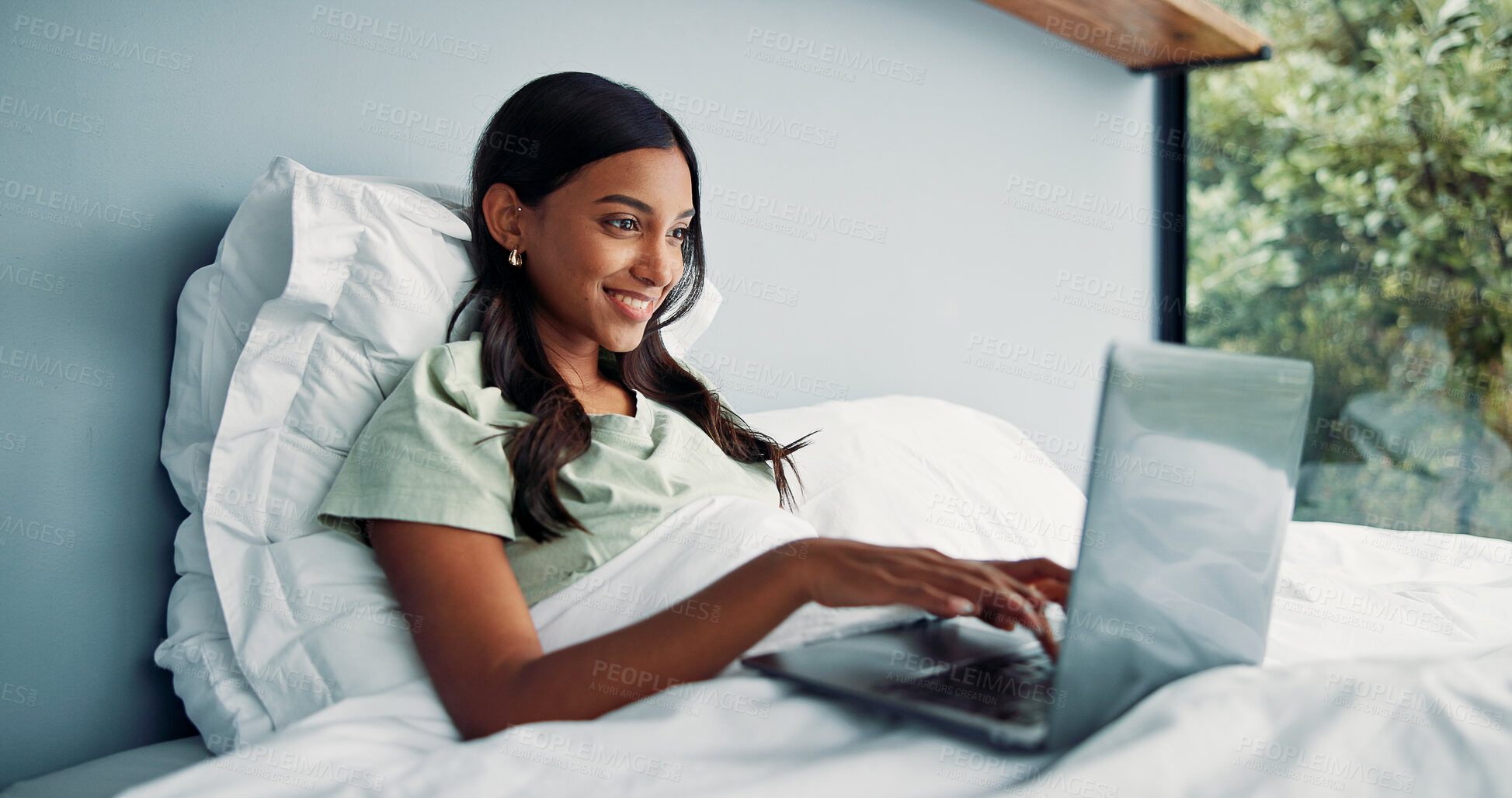Buy stock photo Happy woman, typing and remote work in bed with laptop for journalism, news and story publication. Freelance writer, person or pajamas in home with computer for editing article, online blog and post.