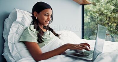 Buy stock photo Woman, editing or remote work in bed with laptop for journalism, news or story publication in hotel. Digital nomad, person and typing in lodge with computer for proofreading article, blog and report.