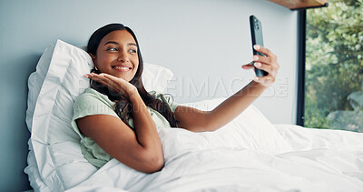 Buy stock photo Photography, happy woman and pose for selfie in bed, cozy morning and smile for profile picture update. Relax, social media post and Indian person with wake up photo, comfortable and rest in home