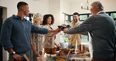 Buy stock photo Christmas, toast and family with wine, celebration and group with meal in dining room, feast or home. Xmas, cheers and people with alcohol for December holiday, gathering and party for festive season