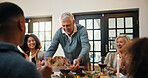 Serving, family dinner and man with chicken at table, applause and congratulations for thanksgiving feast. Clap, support and people in dining room for meal, holiday reunion and cooking celebration