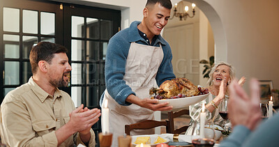 Buy stock photo Serving, family dinner and man with turkey at table, applause or congratulations for thanksgiving feast. Clap, support or group of people in dining room for meal, holiday reunion or celebrate cooking