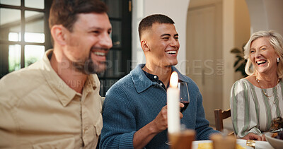 Buy stock photo Laughing, family and thanksgiving dinner in home for holiday season, eating and funny conversation. Festive party, happy people and food at dining table for celebration event, bonding and tradition