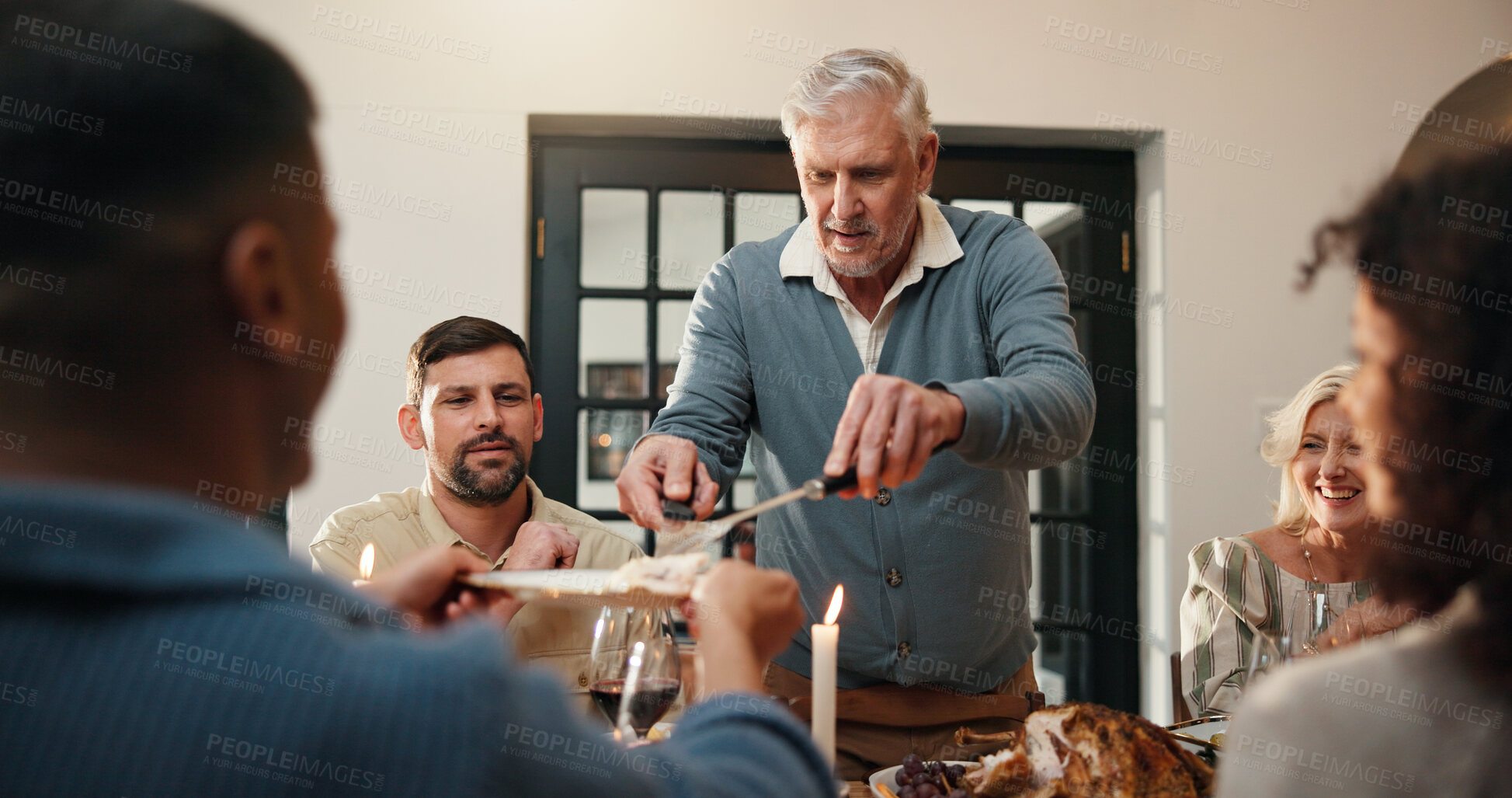 Buy stock photo Thanksgiving, turkey and serve with old man in dining room for holiday season, family gathering or tradition. Festive feast, party and event with people in home for food, hosting and hospitality