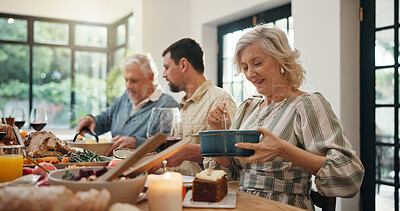 Buy stock photo Serving, family and thanksgiving lunch in home for holiday season, eating together and celebration. Festive feast, food or people with social gathering at dining table for tradition, bonding or party