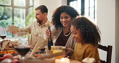 Buy stock photo Thanksgiving, help and serve with family in dining room for holiday season, eating or tradition. Festive feast, party and event with parents and child in home for food, hosting and hospitality