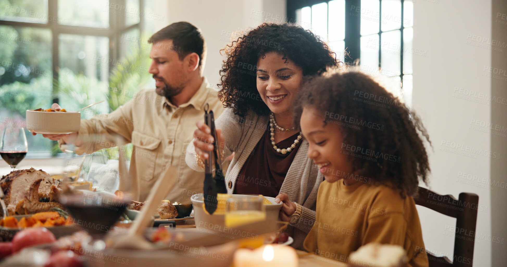 Buy stock photo Thanksgiving, help and serve with family in dining room for holiday season, eating or tradition. Festive feast, party and event with parents and child in home for food, hosting and hospitality