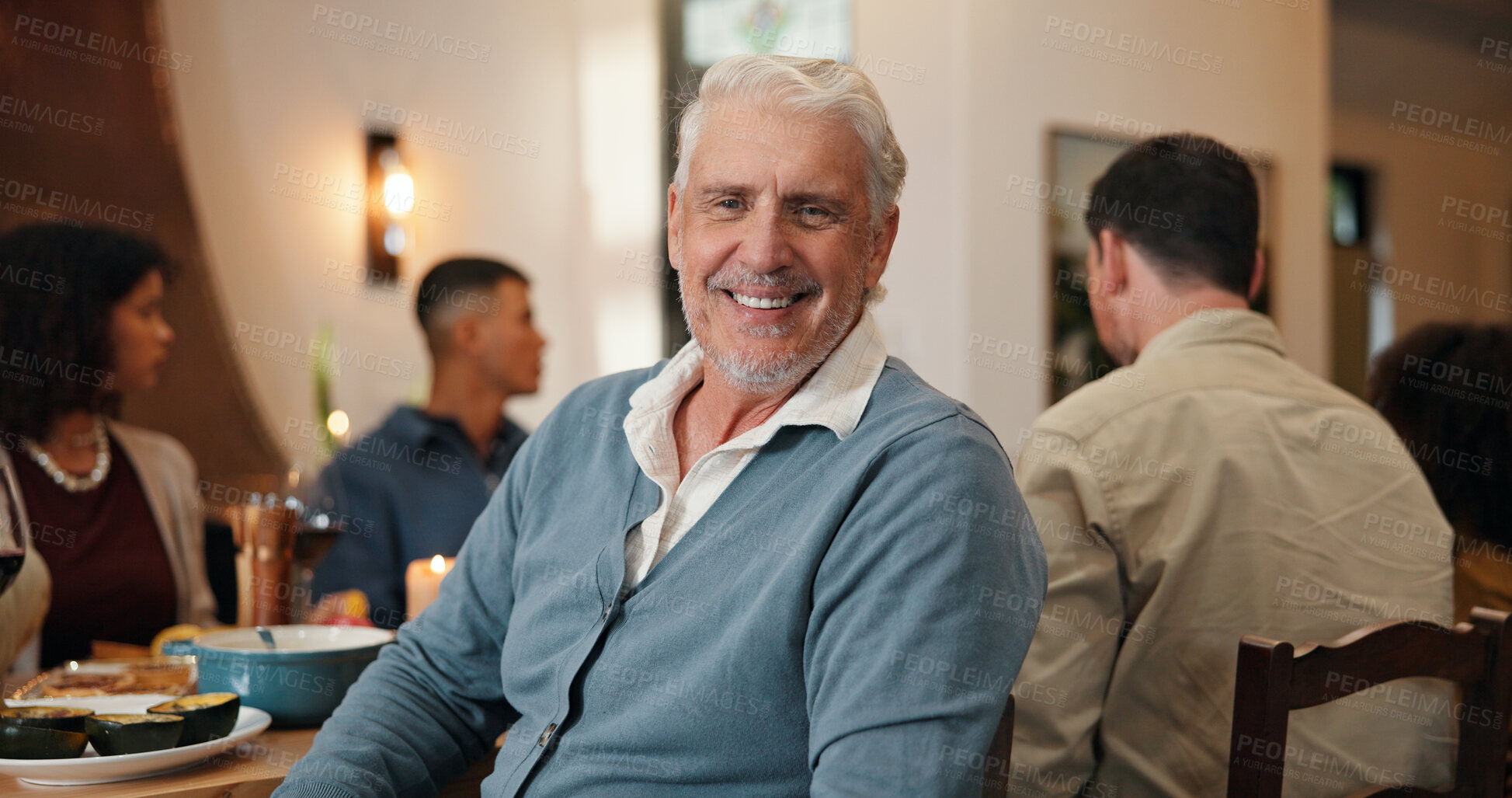 Buy stock photo Mature, happy man and family dinner with table for meal, reunion or holiday gathering in home. Portrait, male person or smile with group celebration for dining together, food or hospitality in house