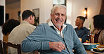 Portrait, old man and smile with family in dining room for dinner, social gathering and thanksgiving. Happy, senior person and bonding for reunion, celebration and tradition of festive season in home