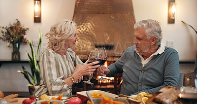 Buy stock photo Home, old couple and toast with wine, Christmas and celebration for festive season, love and dinner. Happy, senior woman and cheers with elderly man in dining room, feast and alcohol for Xmas holiday