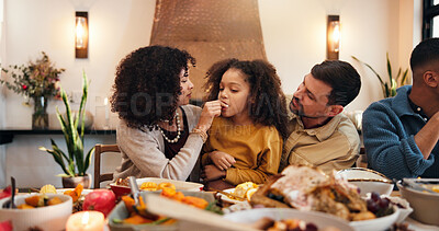 Buy stock photo Thanksgiving, eating and parents with child in dining room for holiday season, dinner or tradition. Festive feast, party and event with people in family home for food, feeding and hospitality