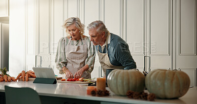Buy stock photo Old couple, cooking or check tablet in kitchen, ingredient preparation or watch video for food tutorial. Online recipe, blog post or senior woman with man reading with tech, steps or meal instruction