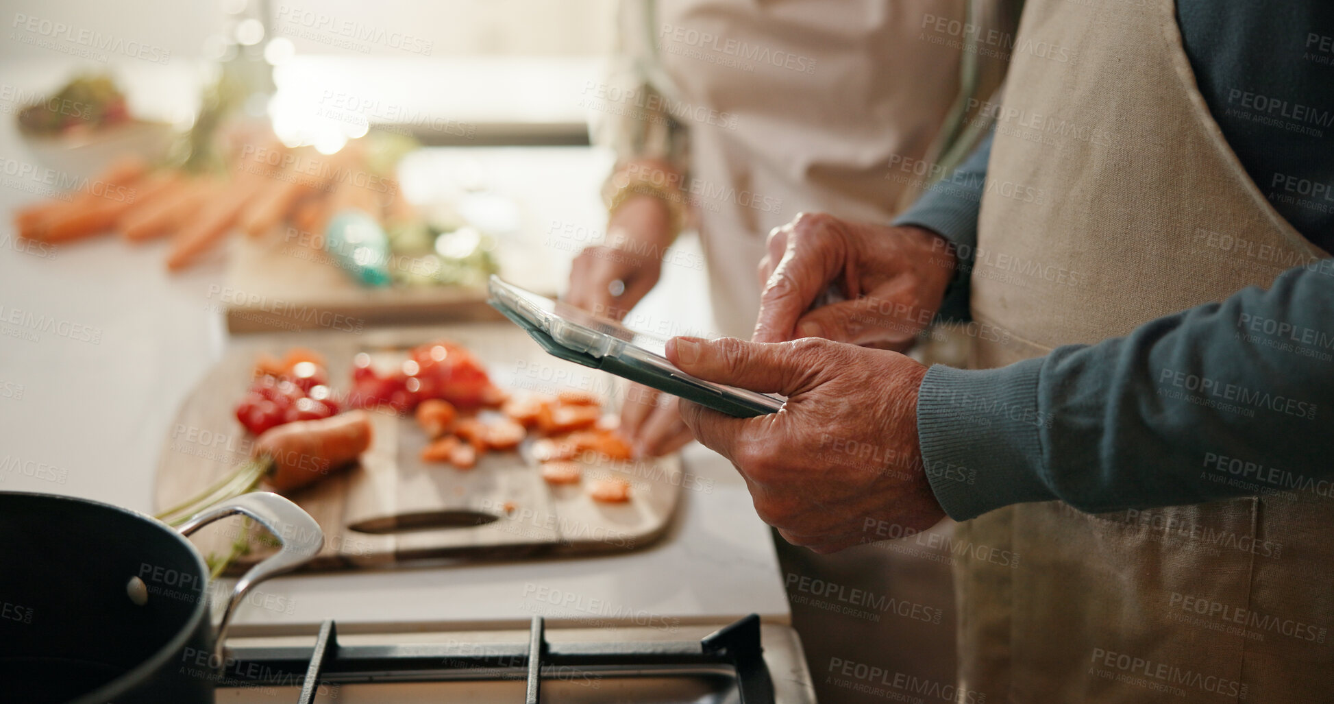 Buy stock photo Senior, couple and hands with tablet for cooking recipe, online tutorial or meal prep in kitchen. Man, woman or research with technology, vegetables or ingredients for chef course or tips in home