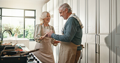 Buy stock photo Cooking, dance and senior couple in kitchen for lunch, supper and prepare food for bonding in home. Marriage, retirement and happy old man and woman for meal prep, love and anniversary dinner